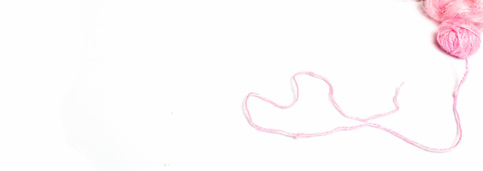 Fototapeta na wymiar a pink yarn ball , knitting banner design