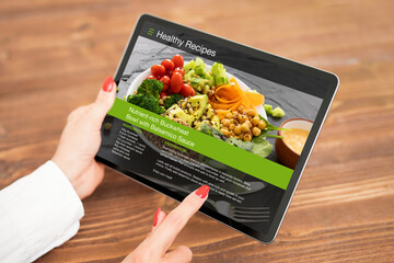 Woman browsing meal recipes on tablet