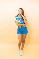 Portrait beautiful young asian woman wear colorful shirt for songkran festival