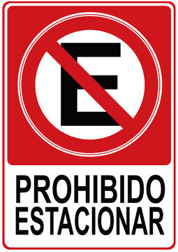 A sign that says in spanish language : no parking. parking is prohibited.
