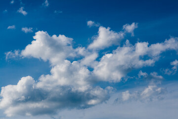 Naklejka na ściany i meble Beautiful white clouds against the blue sky