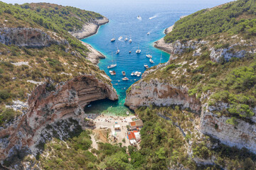 Aerial drone shot of iconic Stiniva cove beach of Adriatic sea on Vis Island in Croatia summer