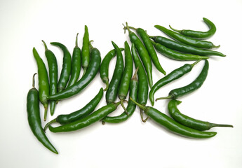 Spicy green chilli peppers isolated on white background