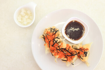 Gyoza with Shrimp Roe in Dishes with Sauce, Chinese Food, Top View.