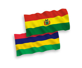 National vector fabric wave flags of Bolivia and Republic of Mauritius isolated on white background. 1 to 2 proportion.