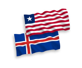 National vector fabric wave flags of Liberia and Iceland isolated on white background. 1 to 2 proportion.