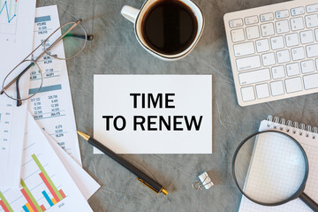 Time to renew is written in a document on the office desk, diagram and keyboard