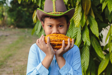 Fresh cocoa pods in the hands of farmers