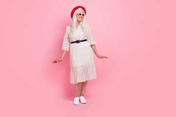 Full length body size view of pretty cheerful grey-haired woman posing having fun isolated over pink pastel color background