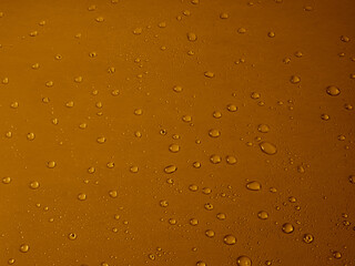 Random water drops on the blue PVC surface