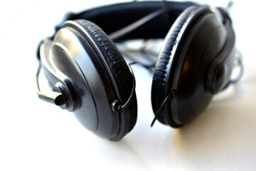 Fototapeta na wymiar Black headphones with headset on white background