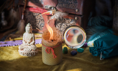 Magic scene, Mystical atmosphere, candle and other stuff on the table, esoteric concept 