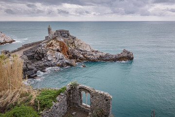 Portovenere (Porto Venere) in Liguria, Italy: beautiful aerial scenic view of the Church of St....