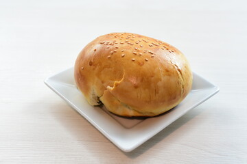 Freshly baked bakery displayed on white wooden background