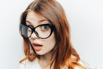 Fototapeta premium pretty woman with glasses red lips glamor modern style close-up