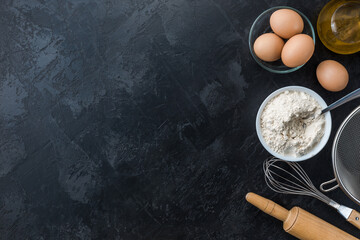 Baking cooking Ingredients on black background. Top view. Frame copy space.