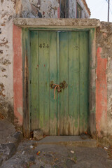 Old traditional wooden door in the village of Mesotopos, in Lesvos (Lesbos) island, Aegean sea, Greece, Europe.