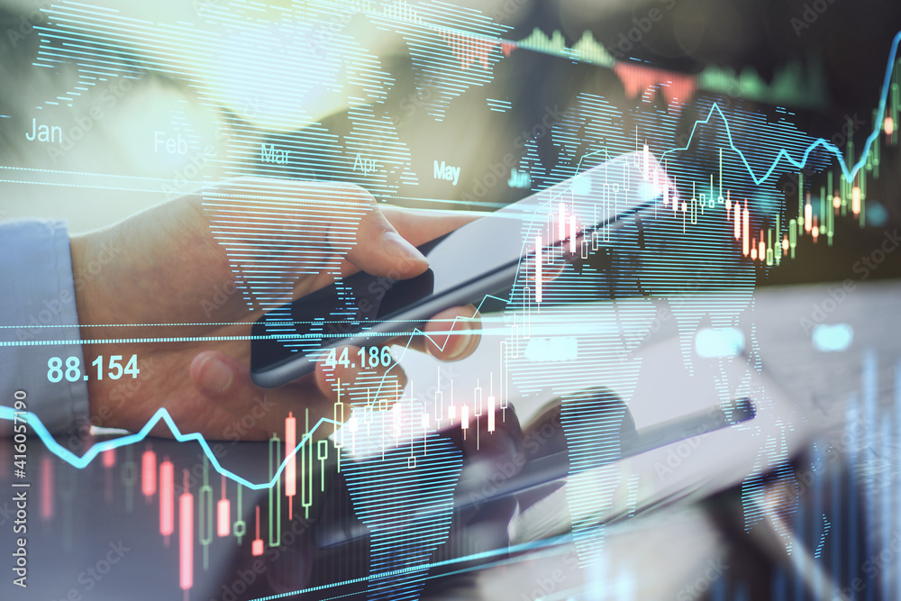 Poster Online trading business concept with man hand using smartphone and transparent digital display with stock market graphs and diagram