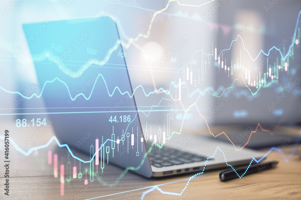 Aufkleber online stock market concept with transparent digital screen with financial graphs and opened laptop 
