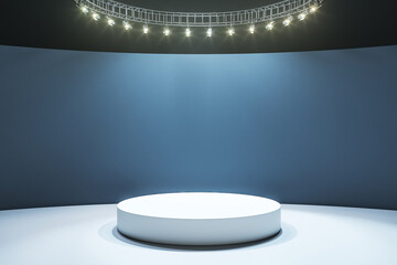 White round podium on light floor in empty hall with dark wall and led lights
