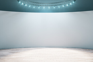 Empty spacious exhibition room with light wall, wooden floor and led light on top. Mock up