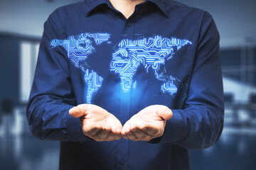 Big data technology concept with businessman hands and digital microchip world map above