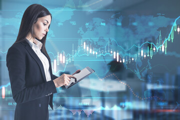 Stock market analysis concept with businesswoman checking trading results using digital tablet at financial graphs screen background