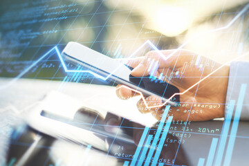 Trading business online with businessman hand using smartphone and digital display with financial graphs and stock data