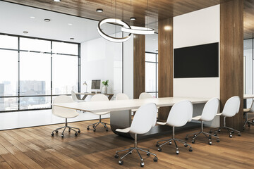 Modern spacious conference room with wooden floor and decoration elements, white furniture, tv monitor above table and city view