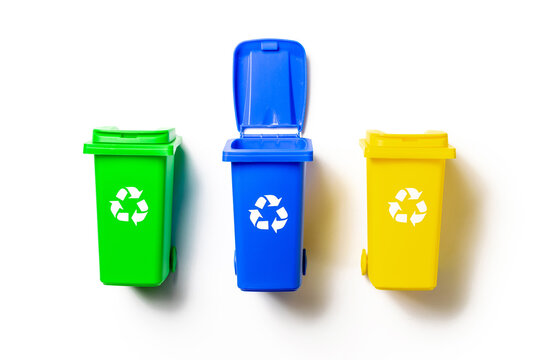 Recycled plastic. Bin container for disposal garbage waste and save environment. Yellow, green, blue dustbin for recycle paper and glass can trash isolated on white background.