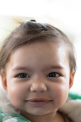 Asian Indian baby girl portrait closeup. A cute baby girl with beautiful smile one to three years old 