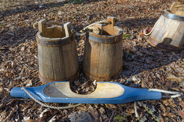 Vintage wooden sap buckets and shoulder carrier. Once used for production of maple syrup.