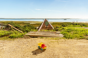 Beautiful landscape with a jetty in Ria Formosa Natural Park, Olhao, Algarve, Portugal
