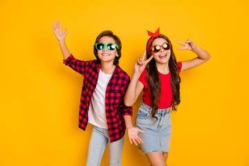Photo of positive boy hands palms girl fingers show v-sign have good mood isolated on yellow color background - Powered by Adobe
