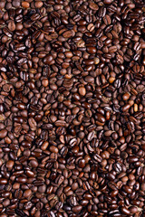 Roasted Ccoffee beans background. Arabic roasting coffee. Ingredient of hot beverage.