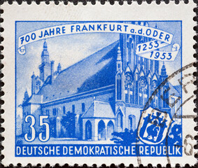 GERMANY, DDR - CIRCA 1953 : a postage stamp from Germany, GDR showing the town hall, city arms. 700 years of the city of Frankfurt a. d. Or