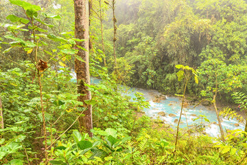 Blue water flowing through Gemelas waterfalls in Bajos del Toro, Costa Rica