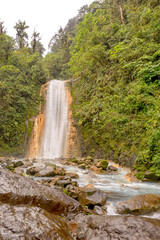 Blue water flowing through Gemelas waterfalls in Bajos del Toro, Costa Rica