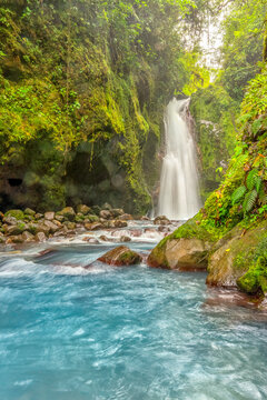 Blue water flowing through Gemelas waterfalls in Bajos del Toro, Costa Rica