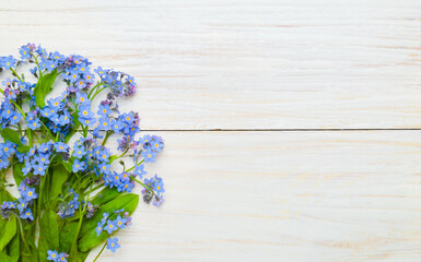 Spring background with bouquet of forget-me-nots flowers