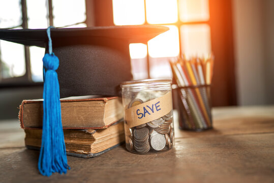 hat graduation and money coins saving for concept investment education and scholarship