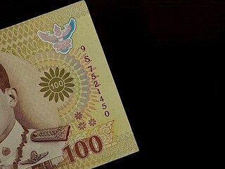 The side Part of the new Thai 100 Baht Banknote with black background