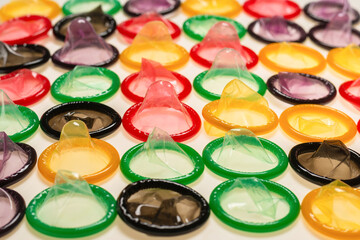 Colorful condoms background.