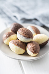 Chocolate easter eggs. Sweet candy eggs on white table.