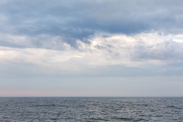 Naklejka na ściany i meble The clouds over the Baltic sea. Beauty seascape