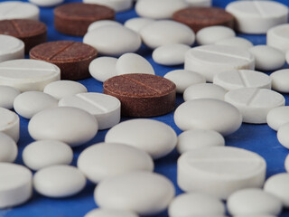 Medical drugs, spray bottles with drops for the nose, maple syrup, vitamins, scattered pills capsule