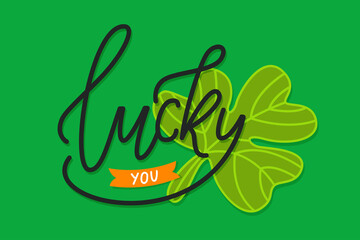 Naklejka premium Calligraphic Inscription with Wishes a Lucky Day for You on Saint Patricks Day. Shamrock - Talisman for Success, Wealth. Hand Drawn Lettering. Calligraphy on St. patricks day greeting card with clover