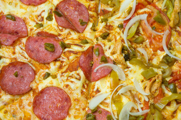 Filling on Italian pizza. Beautiful pizza with varied toppings. pizza texture.