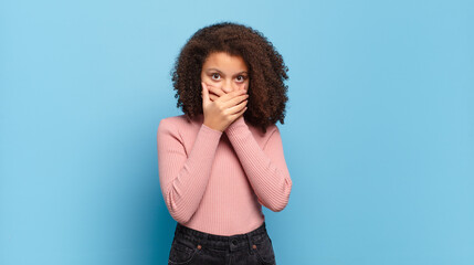  covering mouth with hands with a shocked, surprised expression, keeping a secret or saying oops