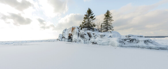 Fototapeta na wymiar Ice covered Hollow Rock on the Lake Superior north shore in Grand Portage, Minnesota